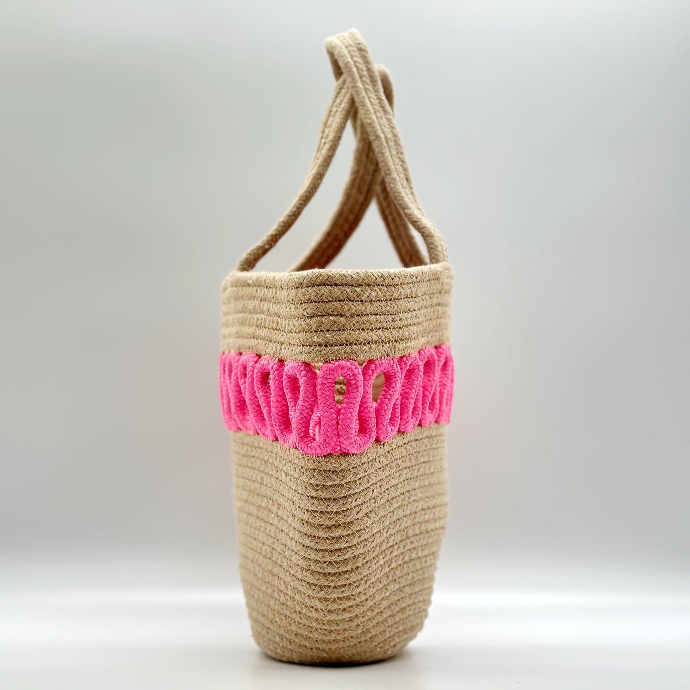 (Pink) beach bag. woven bag. pink, side view.